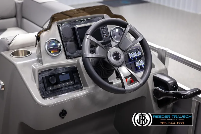 Slide: The Image of 2025 Avalon VEN QL boat dashboard with steering wheel and control panel. - 25