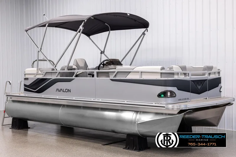 Slide: The Image of 2025 Avalon VEN QL pontoon boat with canopy in showroom. - 3