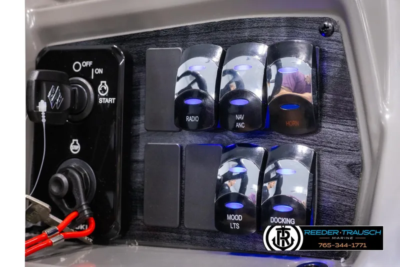 Slide: The Image of Control panel of 2025 Avalon VEN QL boat with illuminated switches and start button. - 31