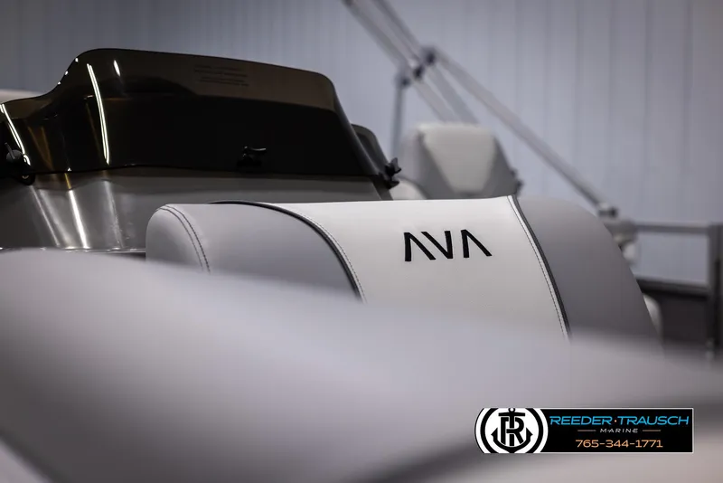 Slide: The Image of 2025 Avalon VEN QL boat interior with sleek white seating and logo. - 34