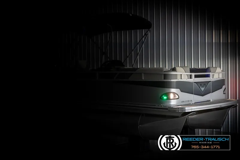 Slide: The Image of 2025 Avalon VEN QL boat in dimly lit storage, side view. - 4