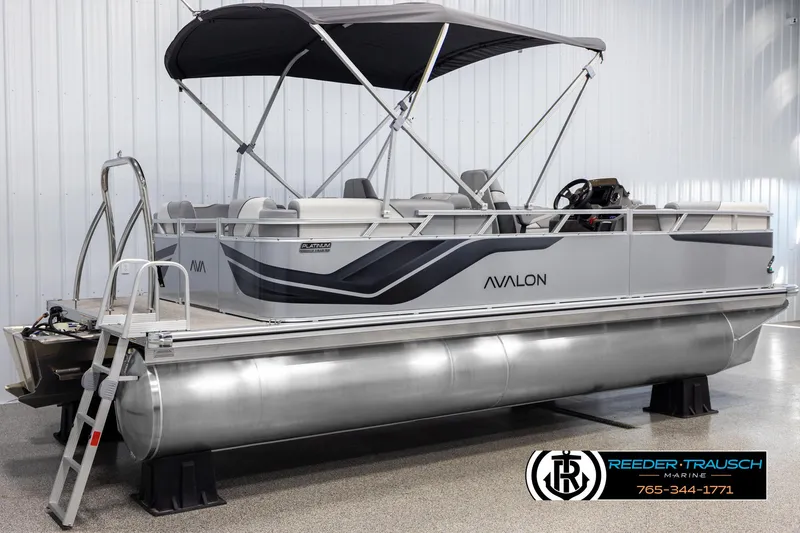 Slide: The Image of 2025 Avalon VEN QL pontoon boat with canopy in showroom. - 6