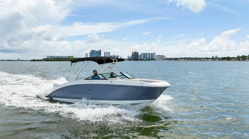 Slide: The Image of 2023 Sea Ray SDX 270 Outboard cruising on a sunny day. - 12