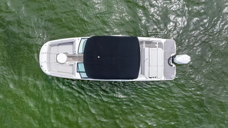 Slide: The Image of Aerial view of 2023 Sea Ray SDX 270 Outboard boat on green water. - 13