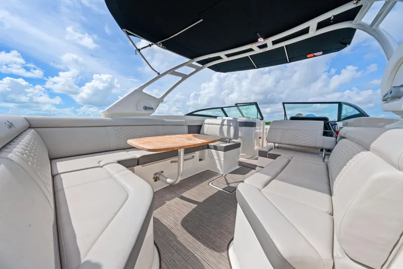 Slide: The Image of Luxurious interior of 2023 Sea Ray SDX 270 Outboard boat with spacious seating and table. - 17