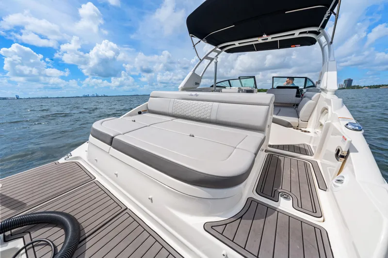 Slide: The Image of 2023 Sea Ray SDX 270 Outboard boat with spacious seating on open water. - 18