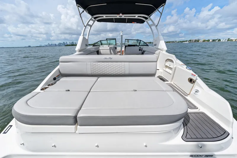 Slide: The Image of 2023 Sea Ray SDX 270 Outboard boat with spacious seating on open water. - 19