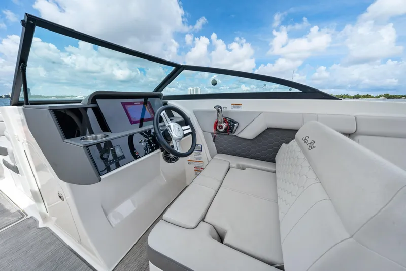 Slide: The Image of 2023 Sea Ray SDX 270 Outboard interior with modern dashboard and comfortable seating. - 23