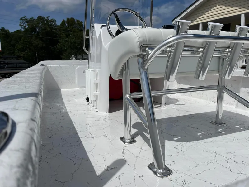 Slide: The Image of 2025 Coastal Skiff 171 boat interior with sleek seating and rod holders. - 14
