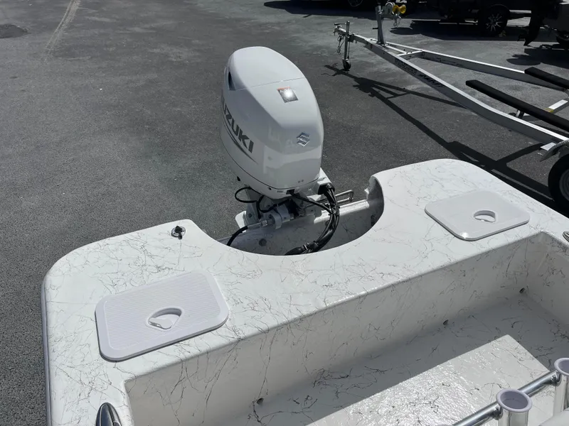 Slide: The Image of 2025 Coastal Skiff 171 boat with Suzuki outboard motor on a trailer. - 16