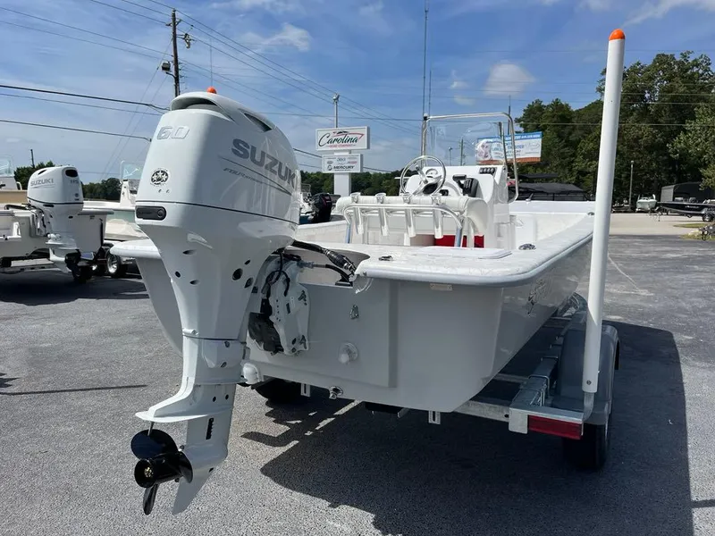 Slide: The Image of 2025 Coastal Skiff 171 boat with Suzuki outboard motor on trailer. - 3