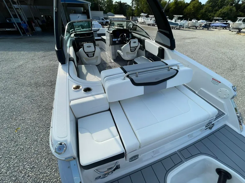 Slide: The Image of 2025 Chaparral 270 OSX boat interior with white seating and modern design. - 46