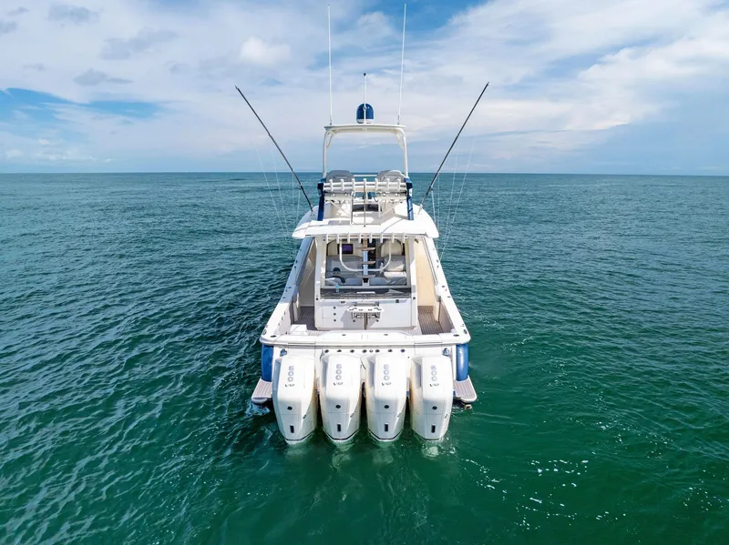 Slide: The Image of 2022 Scout LXF boat with four engines on open sea. - 12