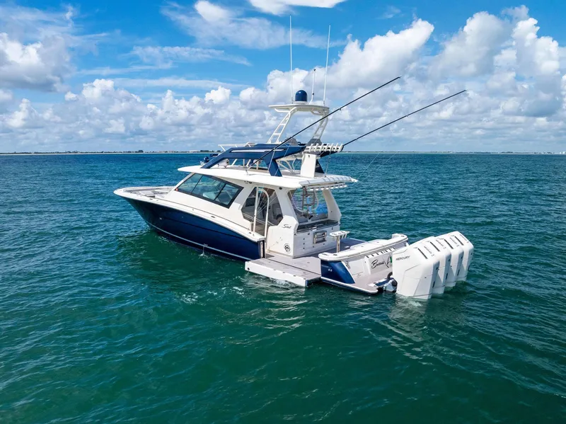 Slide: The Image of 2022 Scout LXF boat on open water under blue sky. - 13