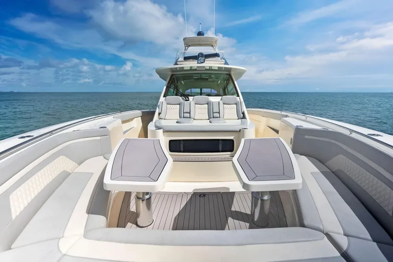 Slide: The Image of 2022 Scout LXF boat with luxurious seating on open water. - 18