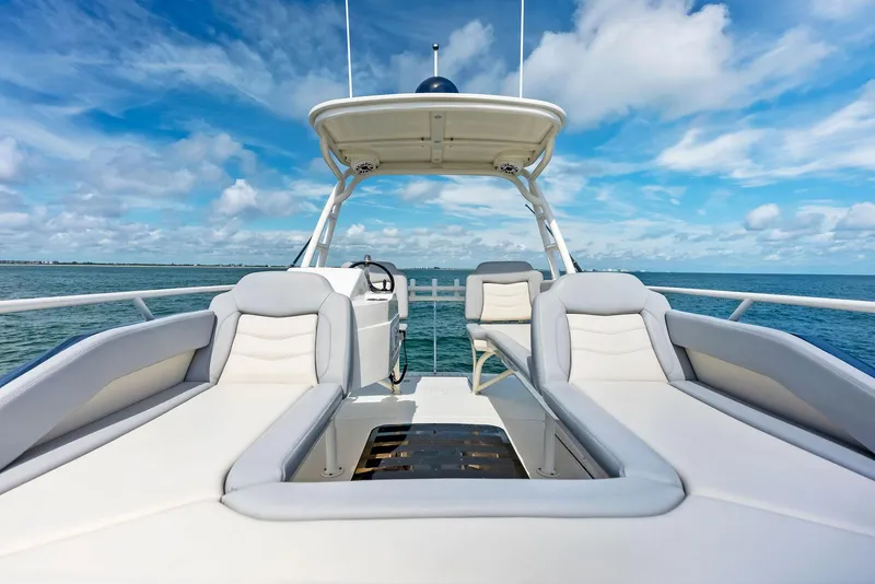 Slide: The Image of 2022 Scout LXF boat interior with luxurious seating and ocean view. - 19