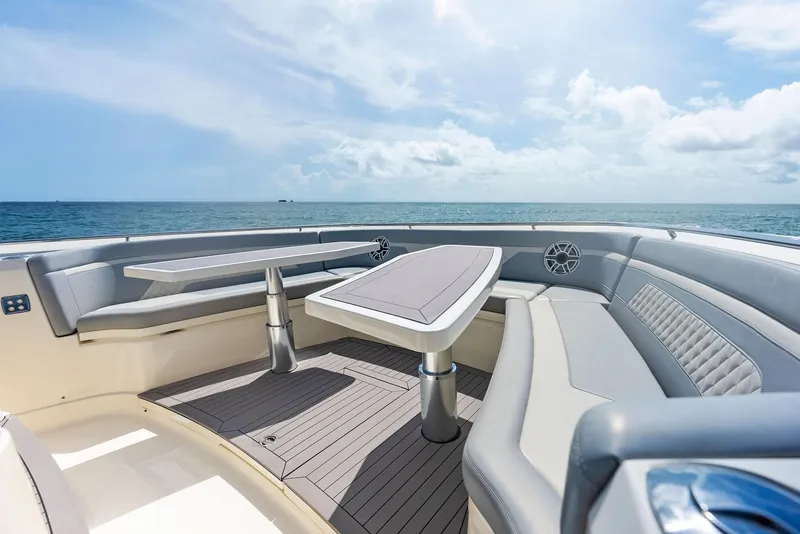 Slide: The Image of 2022 Scout LXF boat interior with luxurious seating and ocean view. - 23