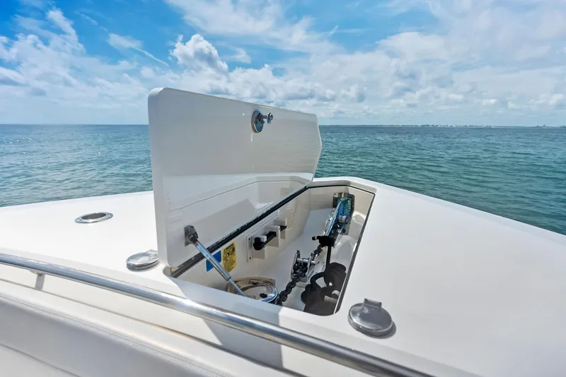 Slide: The Image of 2022 Scout LXF boat with open storage compartment, ocean view. - 27