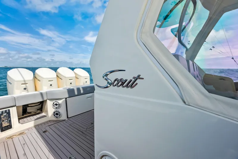Slide: The Image of 2022 Scout LXF boat with multiple engines on open water. - 37
