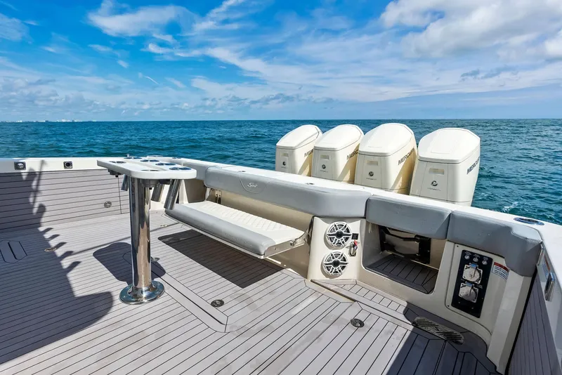 Slide: The Image of 2022 Scout LXF boat deck with quad engines on open sea. - 45