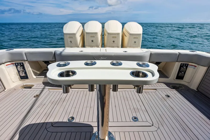 Slide: The Image of 2022 Scout LXF boat deck with fishing rod holders, ocean view. - 48