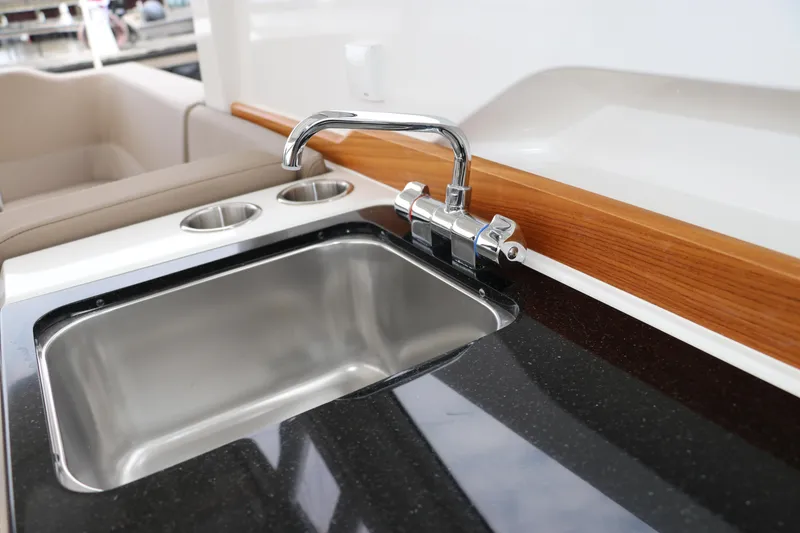 Slide: The Image of 2024 Nimbus Weekender 9 boat interior with sleek sink and faucet design. - 33