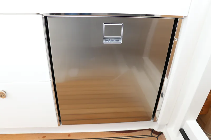 Slide: The Image of Stainless steel refrigerator on 2024 Nimbus Weekender 9 boat interior. - 39