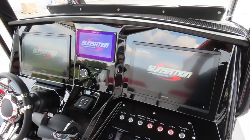 Slide: The Image of 2025 Sunsation 32 CCX dashboard with advanced digital displays and controls. - 12