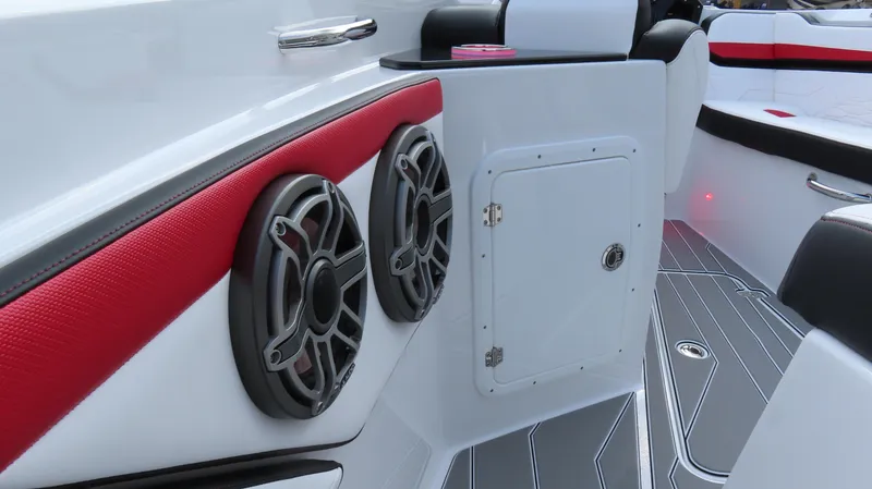 Slide: The Image of 2025 Sunsation 32 CCX boat interior with red accents and dual speakers. - 14