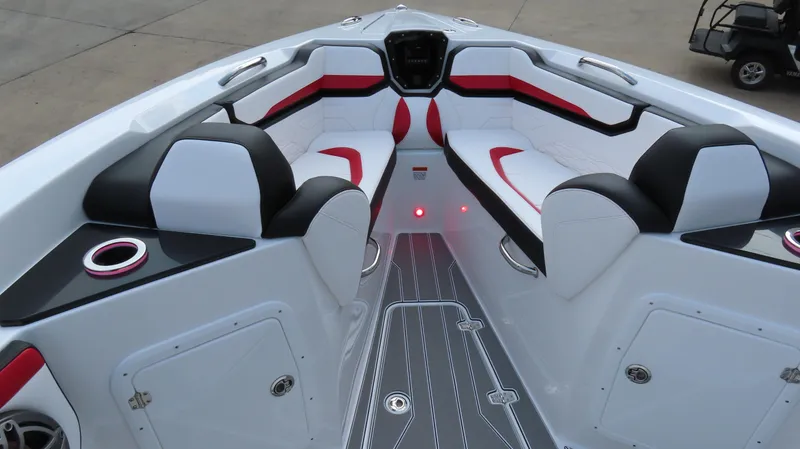 Slide: The Image of 2025 Sunsation 32 CCX boat interior with sleek white and black seating, red accents. - 15