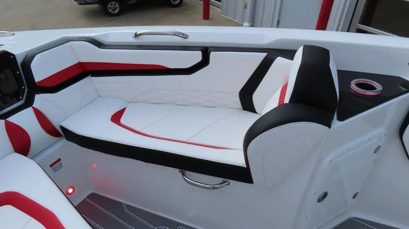 Slide: The Image of 2025 Sunsation 32 CCX boat interior with modern white, red, and black seating design. - 19