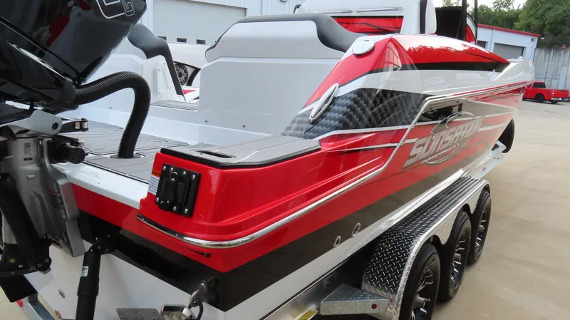 Slide: The Image of 2025 Sunsation 32 CCX boat, red and white design, on a trailer. - 4