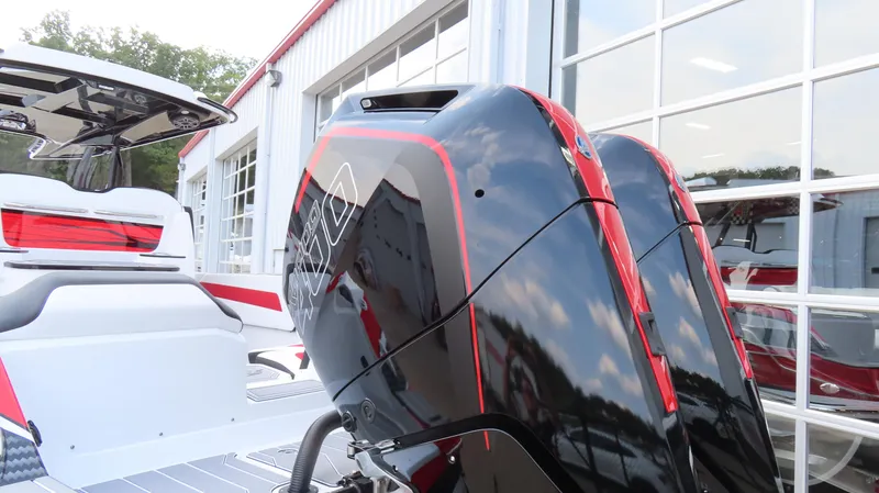 Slide: The Image of 2025 Sunsation 32 CCX boat with sleek black and red outboard engines. - 7