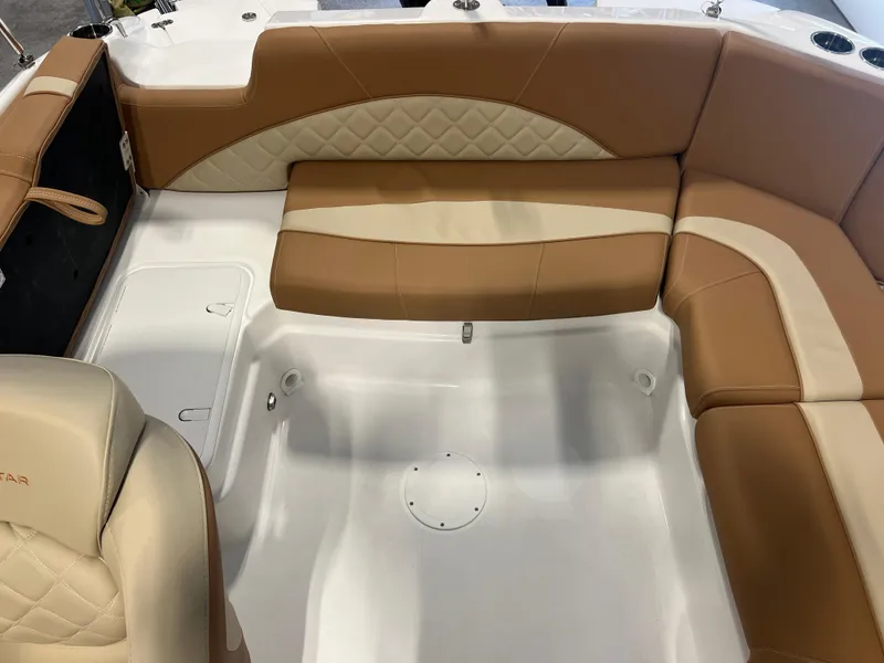 Slide: The Image of 2025 NauticStar 203 SC Deck boat interior with tan and cream seating. - 8