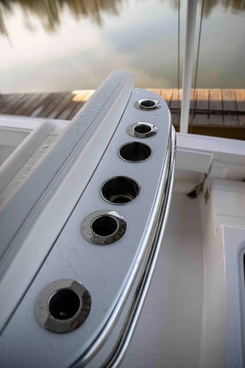 Slide: The Image of 2024 Contender 26 Bay boat rod holders by the dock. - 13