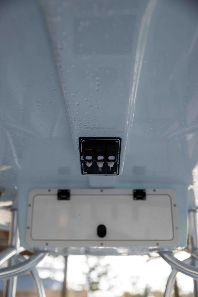 Slide: The Image of 2024 Contender 26 Bay boat console with control panel and storage compartment. - 15