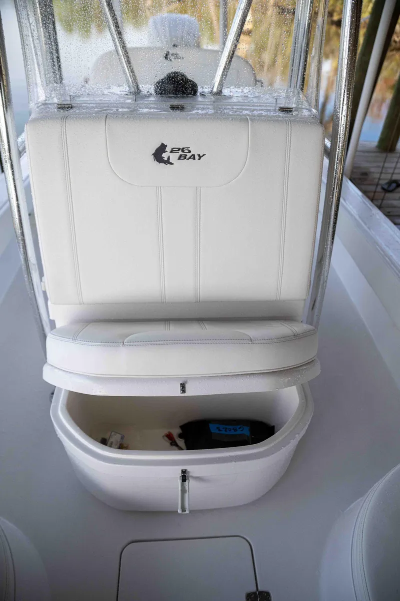 Slide: The Image of 2024 Contender 26 Bay boat with storage compartment and seating. - 17