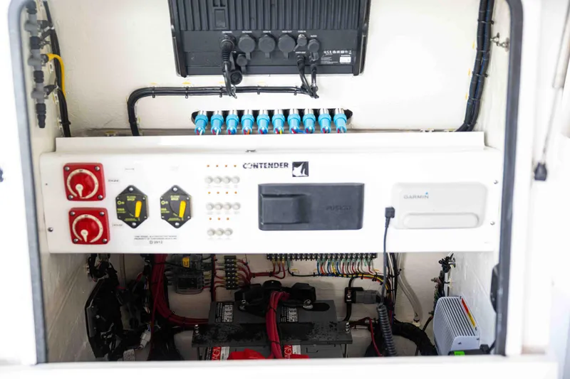 Slide: The Image of 2024 Contender 26 Bay electrical panel with wiring and controls. - 19