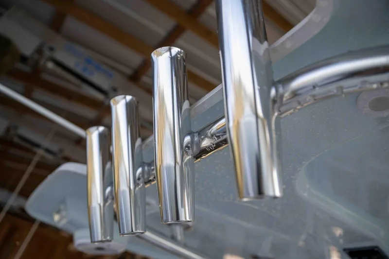 Slide: The Image of Close-up of 2024 Contender 26 Bay boat's sleek chrome rod holders. - 22