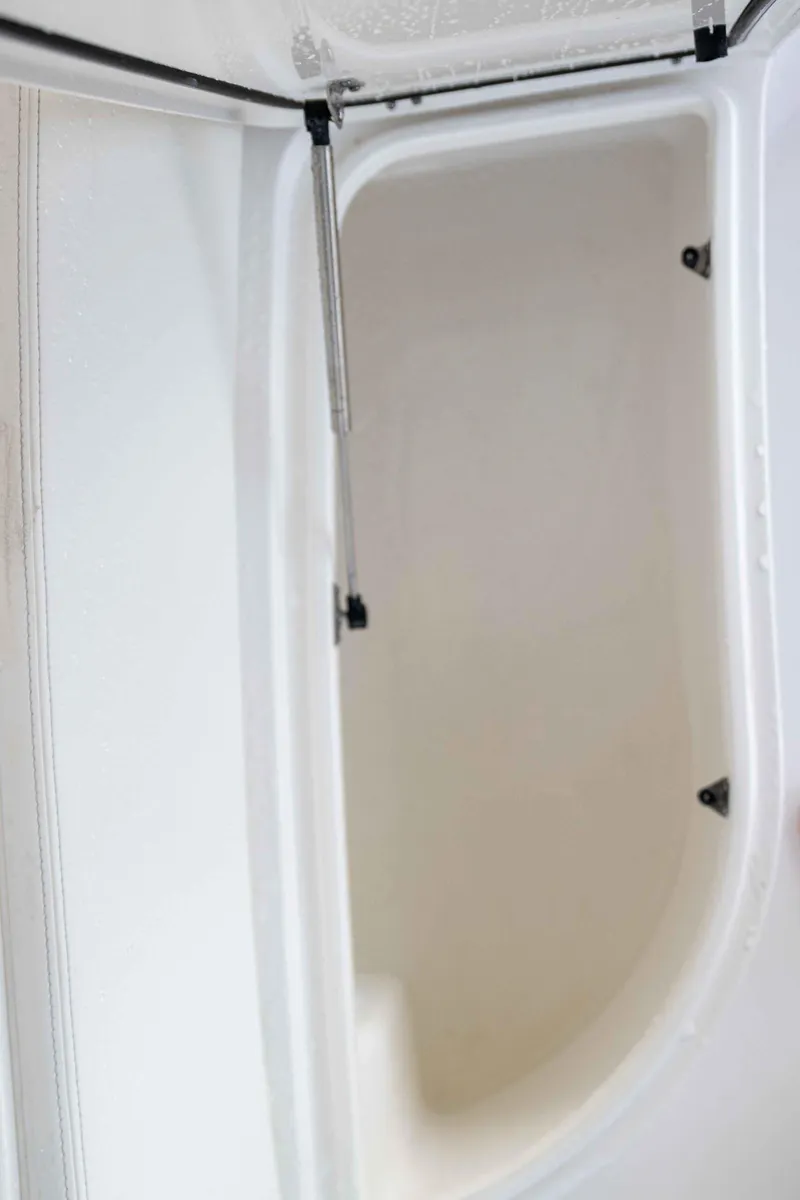 Slide: The Image of 2024 Contender 26 Bay storage compartment with hydraulic lift. - 23