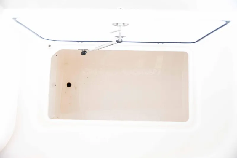 Slide: The Image of 2024 Contender 26 Bay boat storage compartment, open and empty. - 27
