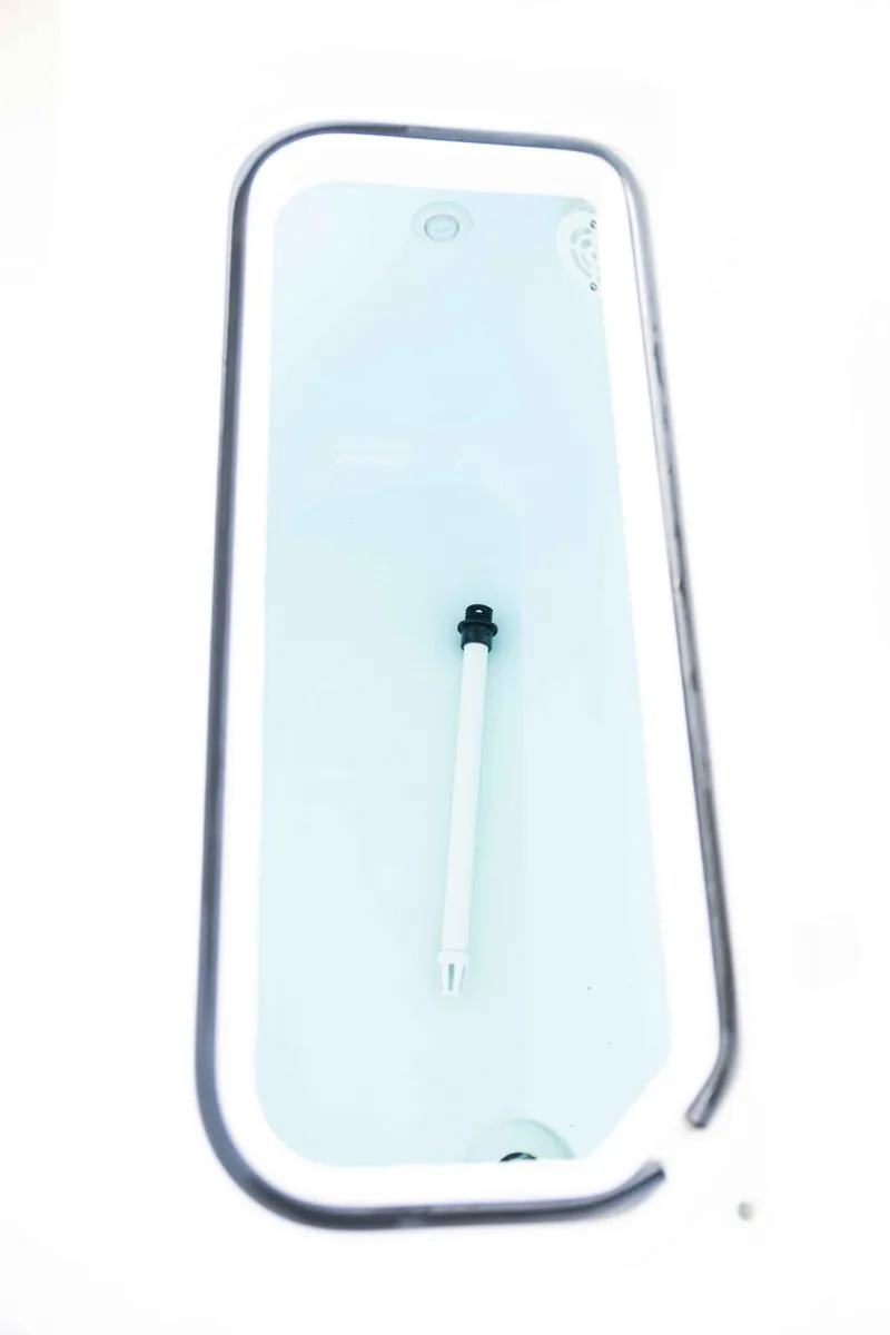 Slide: The Image of 2024 Contender 26 Bay boat livewell interior, featuring a clean, white design. - 32