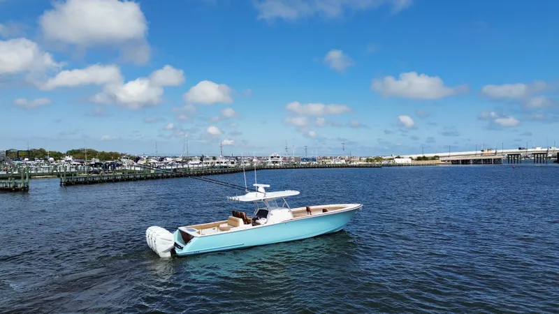 Slide: The Image of 2021 Valhalla Boatworks V-41 cruising on a sunny day in a marina. - 13