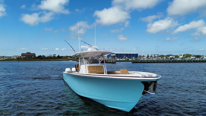 Slide: The Image of 2021 Valhalla Boatworks V-41 in blue on open water under a clear sky. - 14