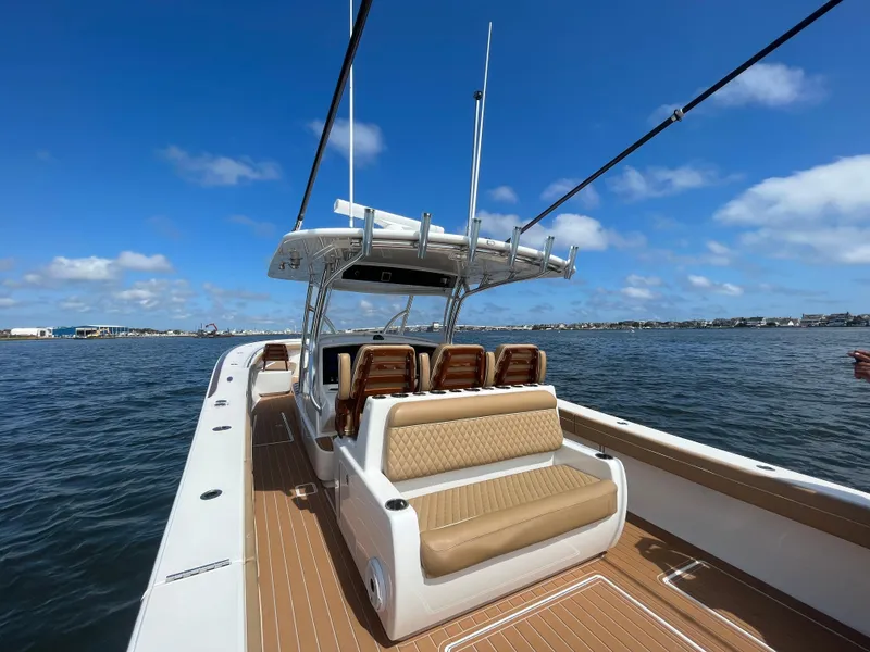 Slide: The Image of 2021 Valhalla Boatworks V-41 on water, featuring spacious seating and sleek design. - 23