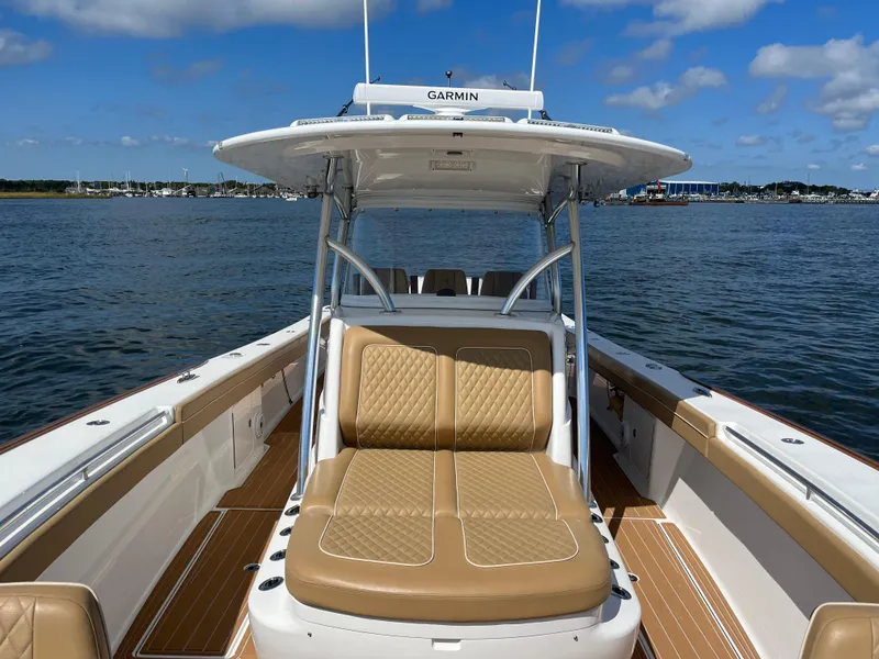 Slide: The Image of 2021 Valhalla Boatworks V-41 on water, featuring tan seating and Garmin equipment. - 25
