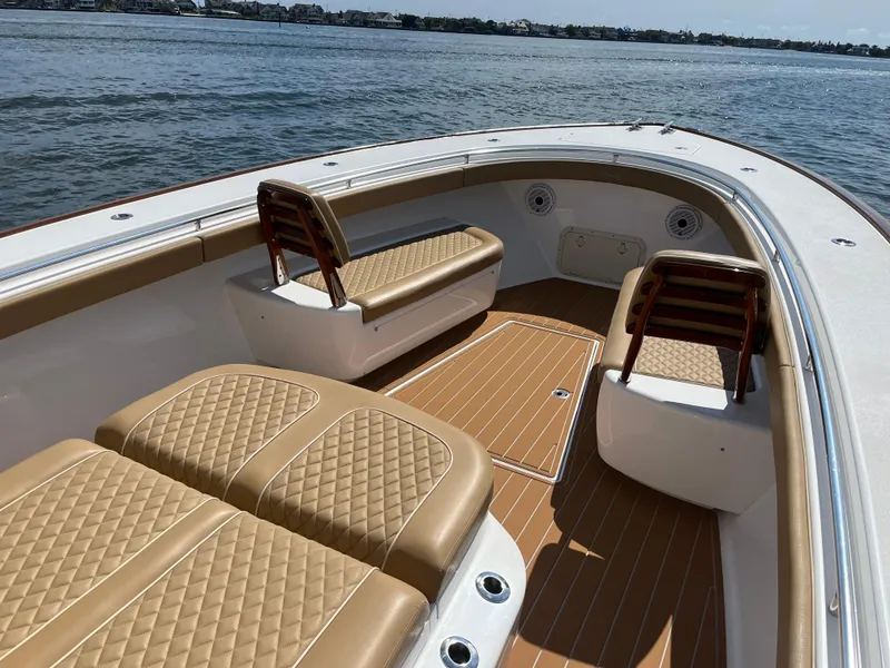 Slide: The Image of 2021 Valhalla Boatworks V-41 with tan seating, spacious deck, and scenic water view. - 26