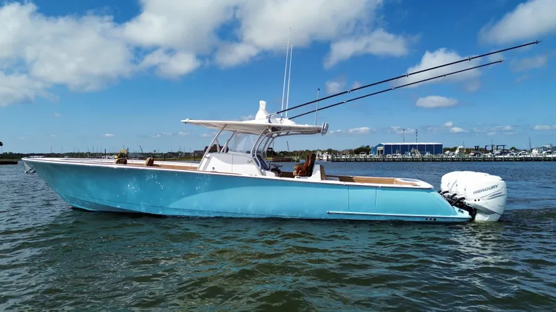 Slide: The Image of 2021 Valhalla Boatworks V-41 in blue on the water, clear sky background. - 5