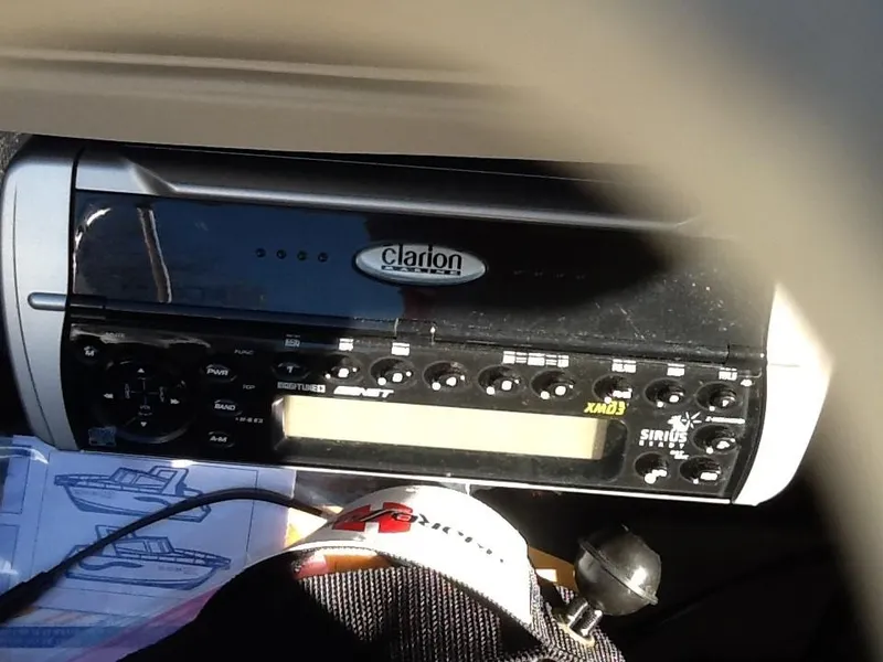 Slide: The Image of Clarion stereo system in a 2004 Glastron 185 GX boat dashboard. - 10