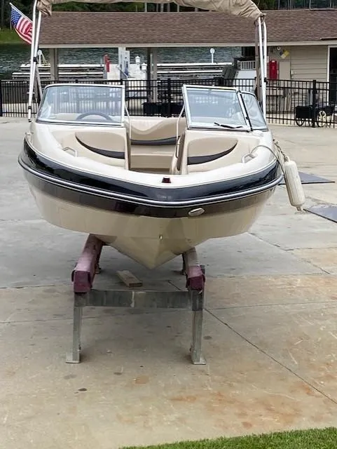 Slide: The Image of 2004 Glastron 185 GX boat on stand, dockside view. - 4